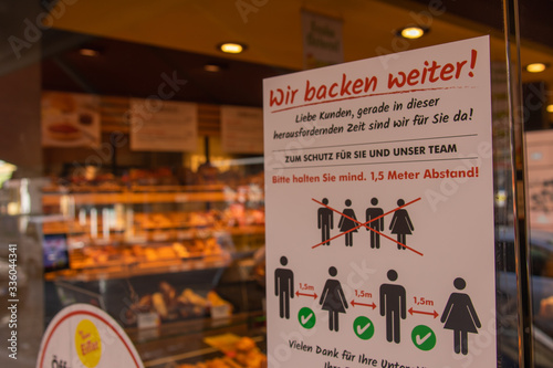 German Sign in front of a store in Frankfurt am Main about the Corona virus pandemic situation