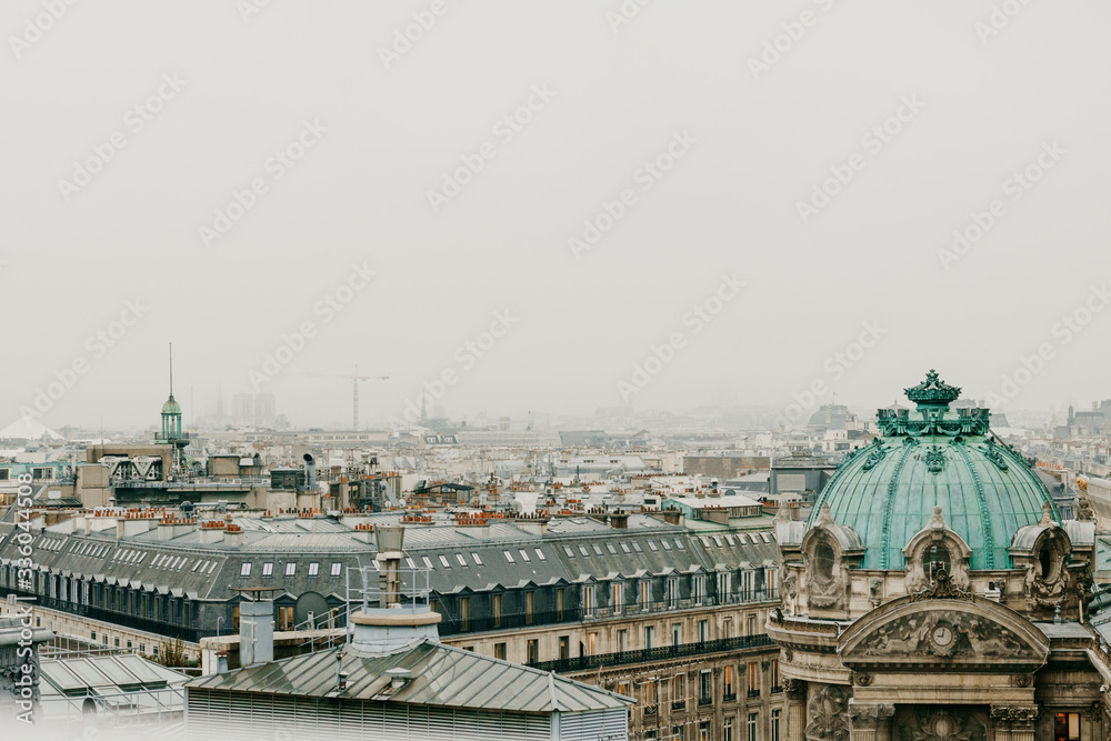 Aerial view of cloudy Paris with grey cloudy sky