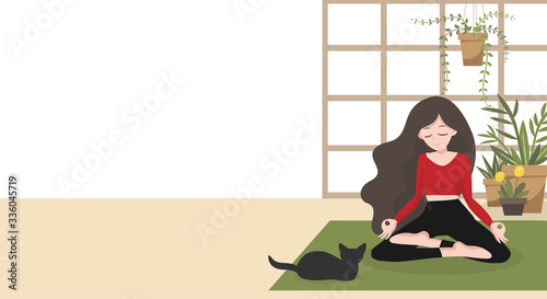 Stay at home in quarantine for be safe and keep calm in during a coronavirus or COVID-19 virus outbreak concept. A woman practices in lotus yoga position in her house with her pet.