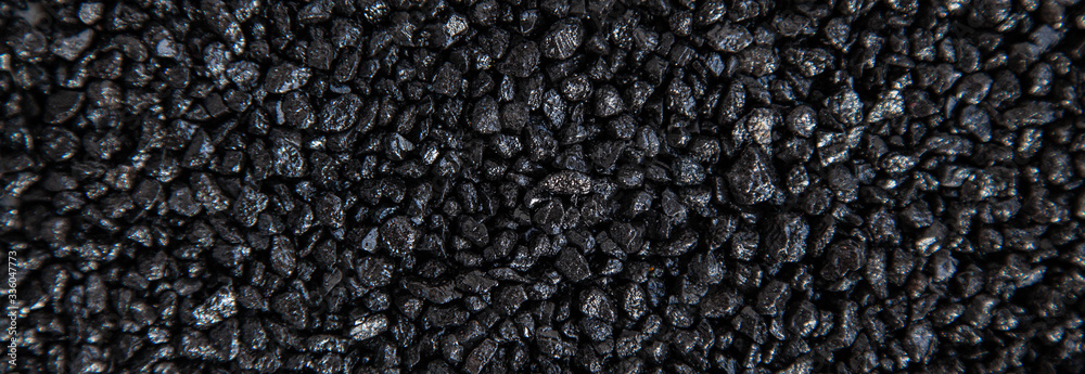 Many small black stones. Background, pattern, texture of small stones, gravel Many small black stones. Background, pattern, texture of small stones, gravel
