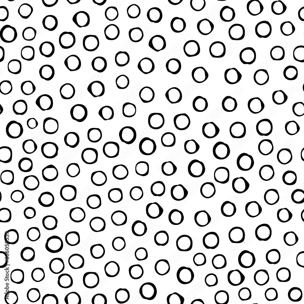 Black circles are arranged in random order with a void inside on an isolated background. Vecton illustration. Stock illustration. You can use the pattern on wrapping paper or fabric.