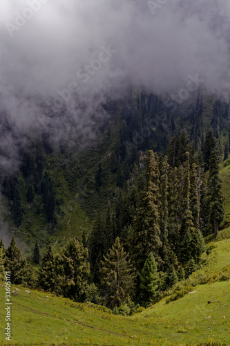 Landscape of green mountains covered with clouds in Naran,Pakistan