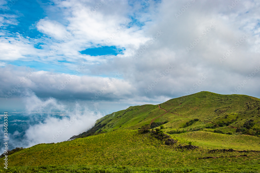mountain with green grass and beautiful sky mountain with green grass and beautiful sky
