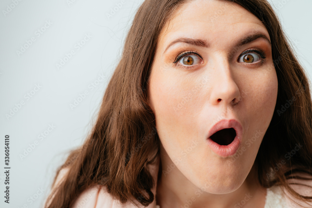 long-haired beautiful young brunette woman surprised long-haired beautiful young brunette woman surprised