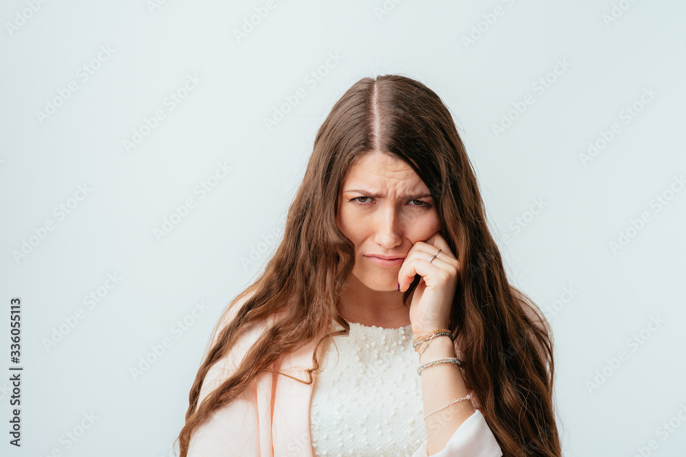 on a gray background young girl crying on a gray background young girl crying