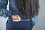woman hand money in back
