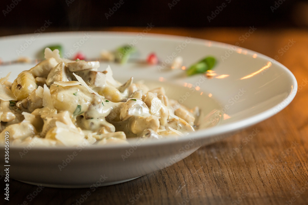 Gnocchi with turkey meat and porcini mushrooms in a cream sauce