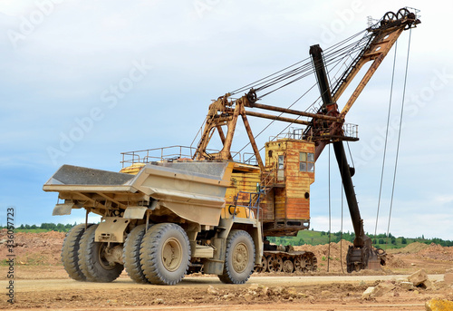Big mining truck transport of minerals in the quarry. Open-cast mining of extracting rock or minerals from the earth. Largest dolomite deposit open-pit mining Gralevo, Belarus, Vitebsk region