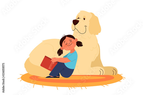 Little girl read to her dog. Happy kid and pet spend time together