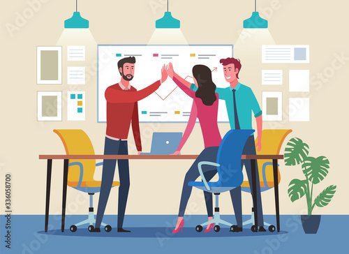 Business people giving high five. Successful teamwork in workplace