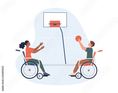 Joyful disabled people in wheelchair playing basketball.