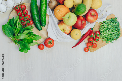 Variety of fruits and vegetables, on the white wooden table, top view, copy space, selective focus