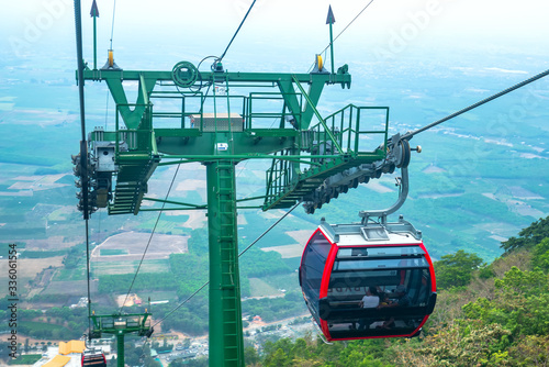 Cable car to Ba Den mountain peak in the morning sunshine to attract tourists to the weekend relaxing, view from cabin in Tay Ninh, Vietnam