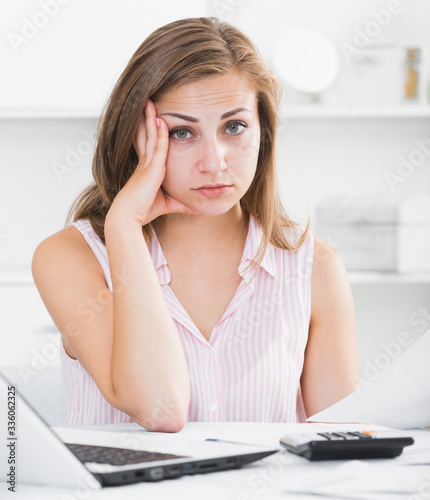 Disappointed girl worried about bills