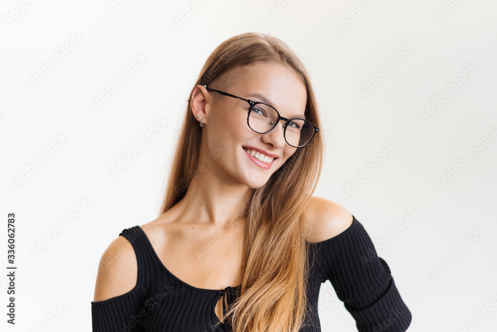 Elegant smiling woman in eyeglasses on white background