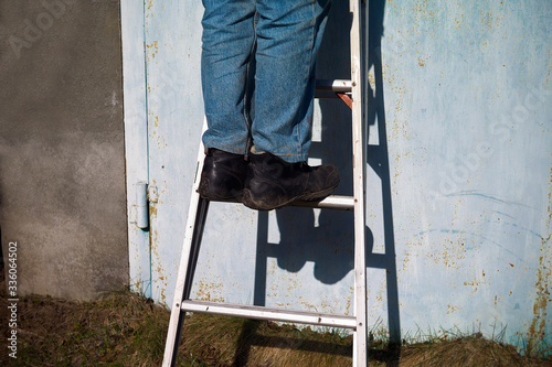 man tanding on a ladder