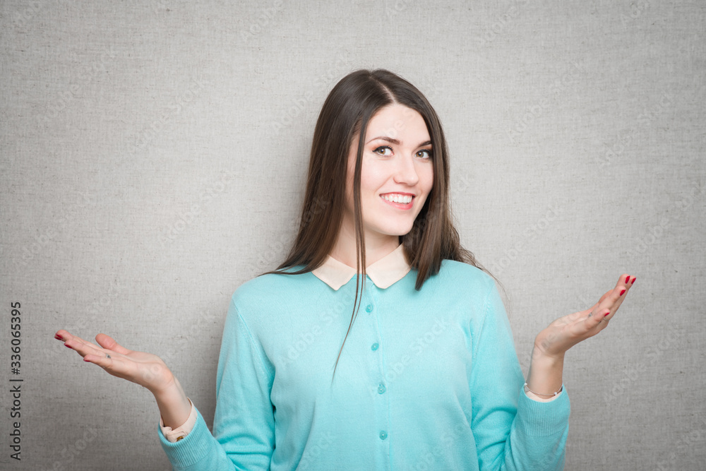 Portrait young woman arms out shrugs shoulders asking who cares so what I don't know. Negative human emotion, facial expression body language life perception bad attitude