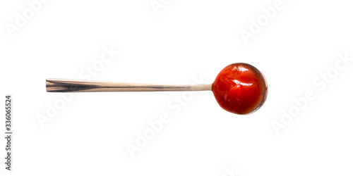 Spoon with ketchup sauce isolated on white background, top view. Close-up seasoning and dip