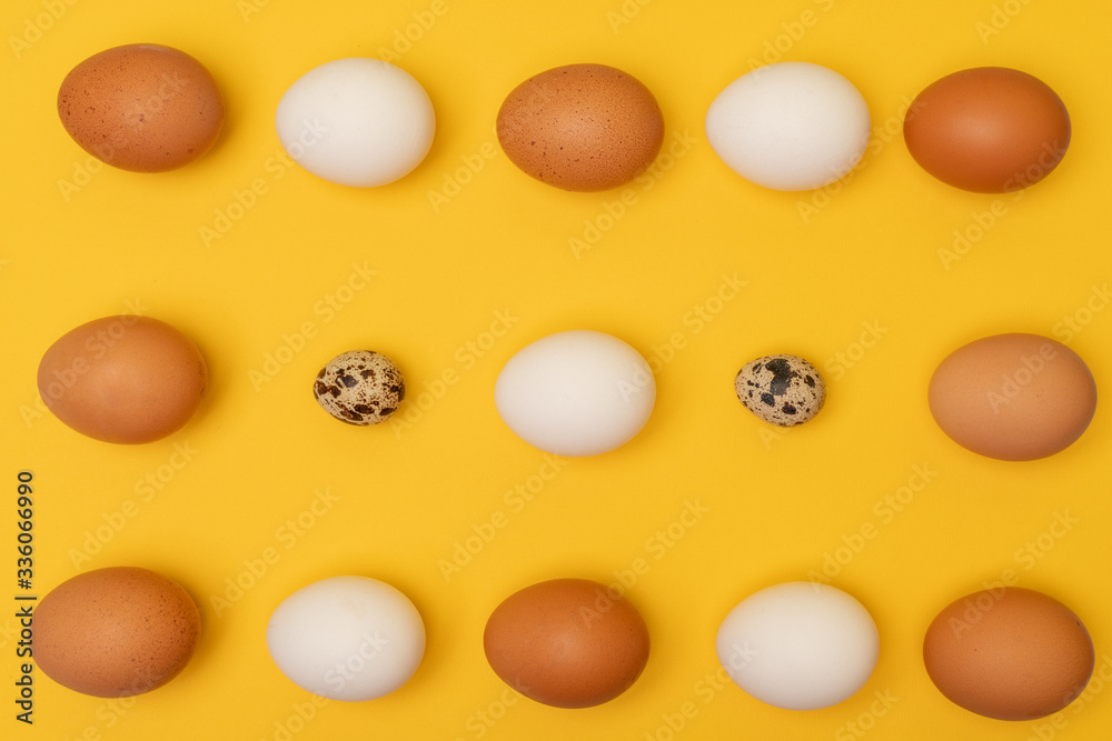 Easter eggs on a yellow background, place for an inscription in the center Easter eggs on a yellow background, place for an inscription in the center