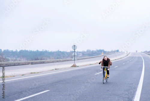 Cyclist riding a bike on an open road