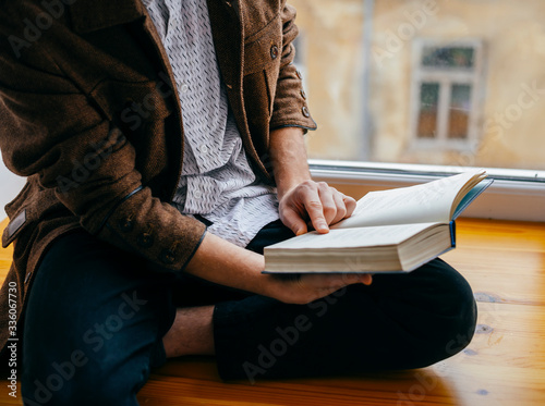 Young man reading a book
