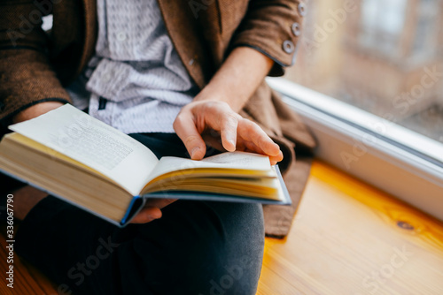 Young man reading a book photo