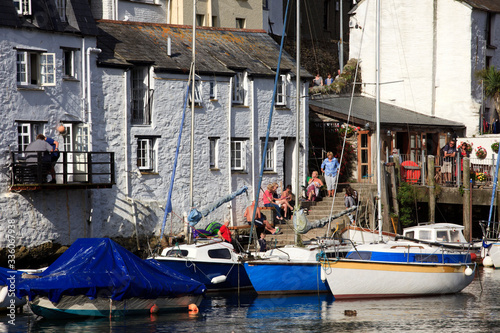 Polperro (England), UK - August 16, 2015: Polperro harbour and village, Cornwall, England, United Kingdom. . photo