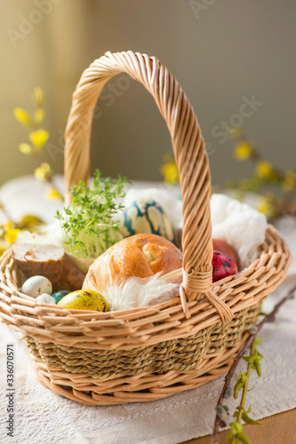 Close up of "swieconka" Polish Easter basket with cress sprouts, egg, bread and sausage