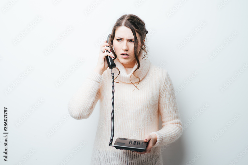on a white background girl talking on the phone working on a white background girl talking on the phone working