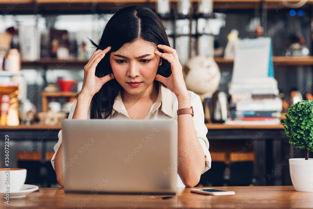 Freelance business woman working with laptop computer he was stressed out with job failing bankruptcy