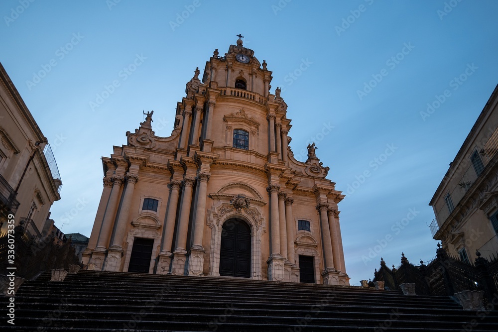 Church of Saint George (Duomo di San Giorgio) in historical town Ragusa, Sicily at early evening with dark blue sky
