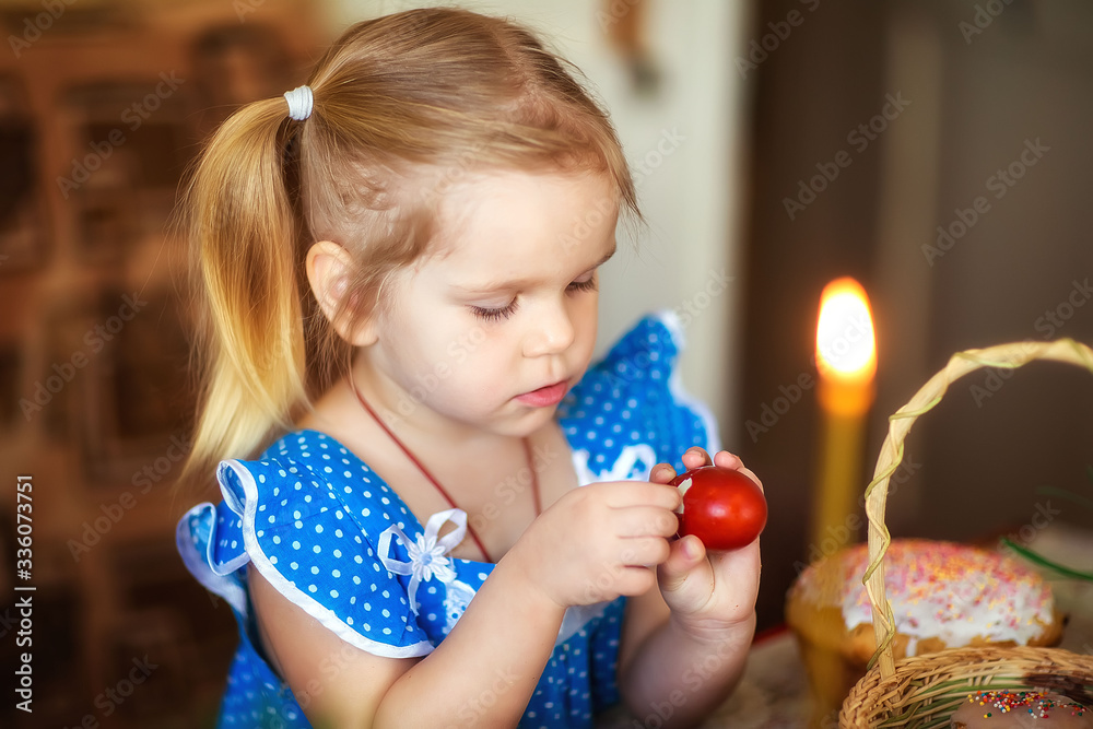 girl cleaning an egg, holiday table, Easter girl cleaning an egg, holiday table, Easter