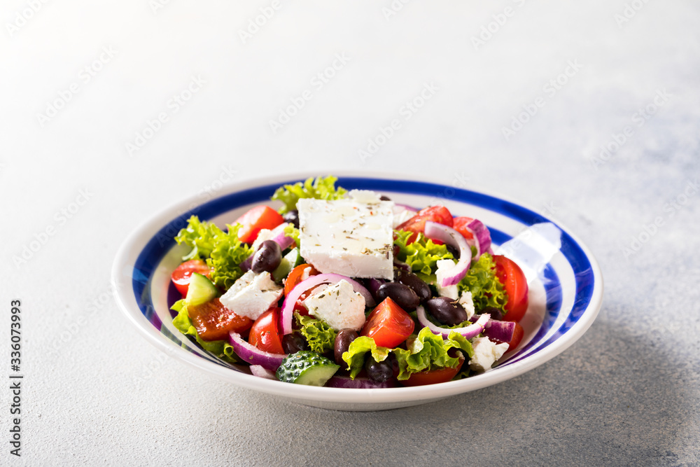 Greek salad of fresh vegetables, olives and feta. Traditional Mediterranean food. Greek salad of fresh vegetables, olives and feta. Traditional Mediterranean food.