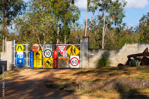 Random signs attached to a farm gate near Tinaroo Falls Dam in Queensland, Australia photo