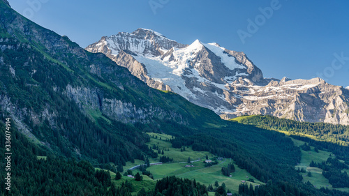 Switzerland, Panoramic view on Wengen and green Alps around