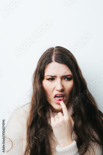 on a white background a young girl with long hair nausea