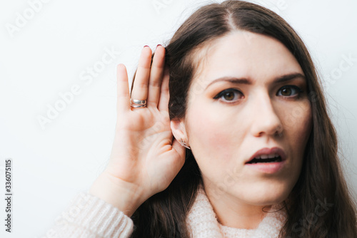 on a white background young girl with long hair overhears