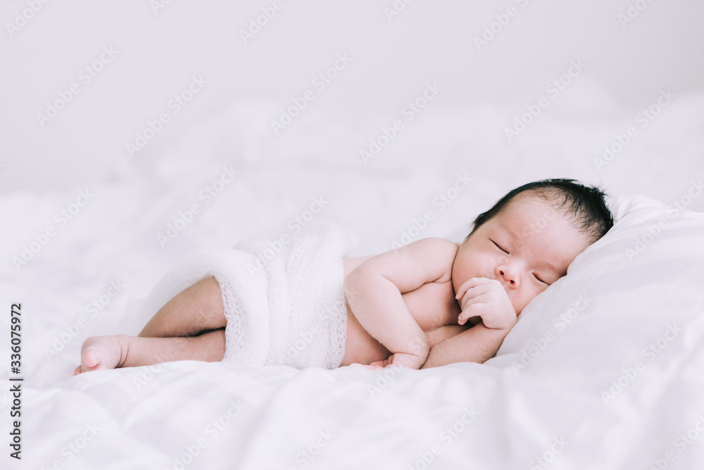 Smiling baby boy lying on a white bed, Family morning at home,Children hygiene. Smiling baby boy lying on a white bed, Family morning at home,Children hygiene.