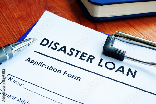 SBA disaster loan application form on the wooden surface. photo