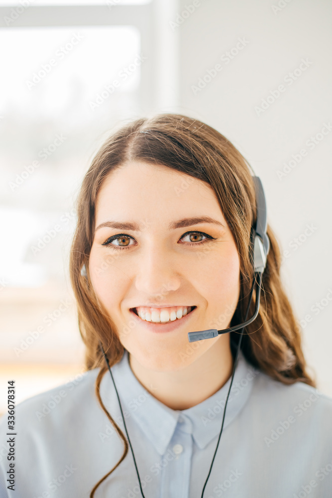 Close-up portrait of a customer service agent near the window Close-up portrait of a customer service agent near the window