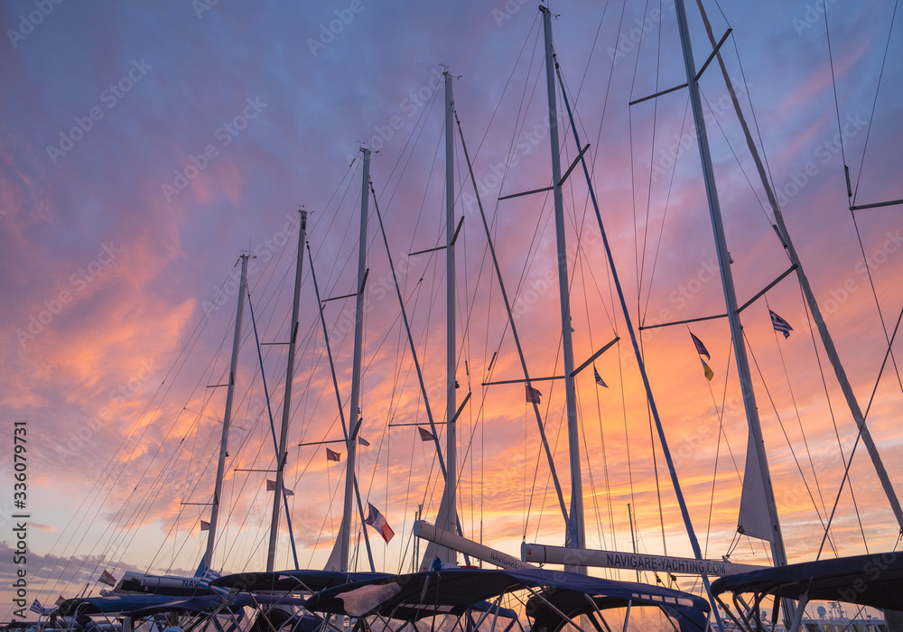 a lot of yacht rows in sunset sky in Greece