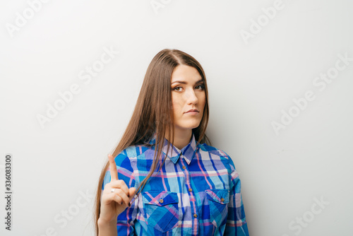 Business woman pointing an idea and smiling - isolated over white