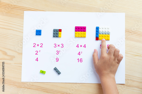 A game for children to learn mathematics. Match the blocks to the account. The child decides the examples, puts the plastic block in the right place. Game for childrenю