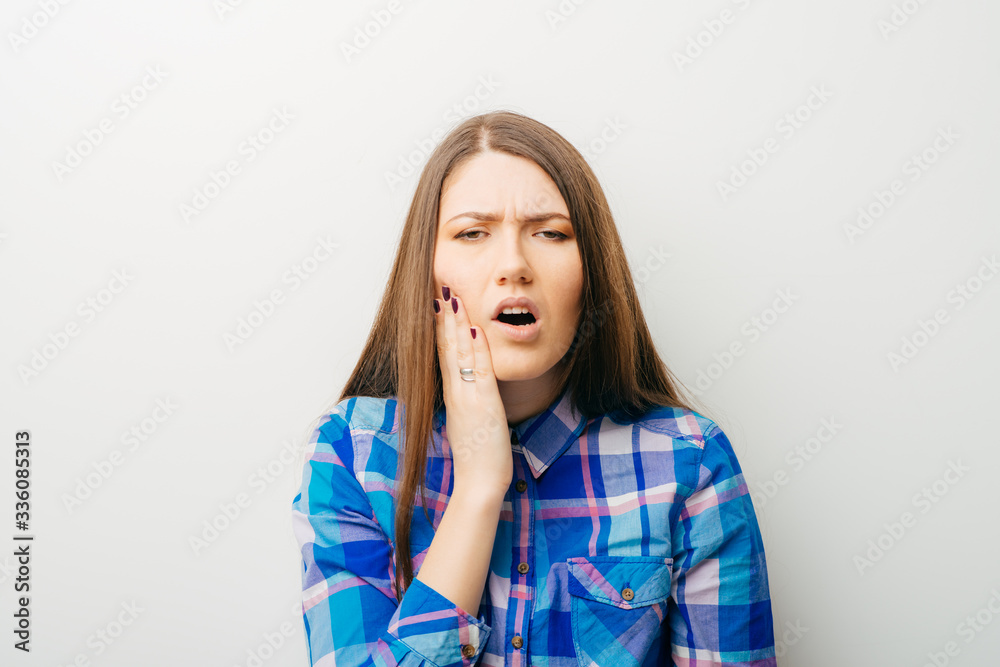 on a white background a young girl toothache on a white background a young girl toothache