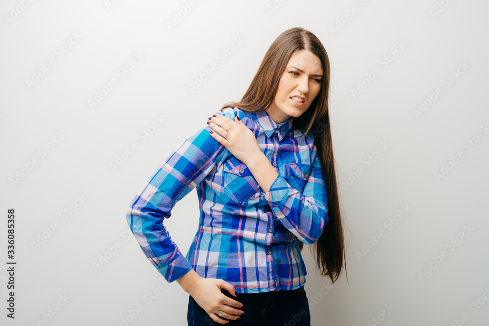 on a white background a young girl sore shoulder