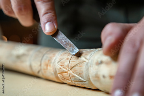 Foto Process of man making wooden walking stick indoors during quarantine