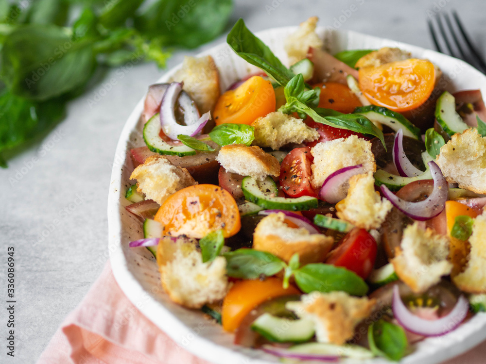 Tuscan Panzanella, traditional Italian salad with tomatoes and bread, basil. Mediterranean healthy food. Tuscan Panzanella, traditional Italian salad with tomatoes and bread, basil. Mediterranean healthy food.