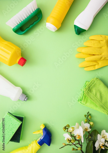 Cleaning products background, detergent bottles and tools