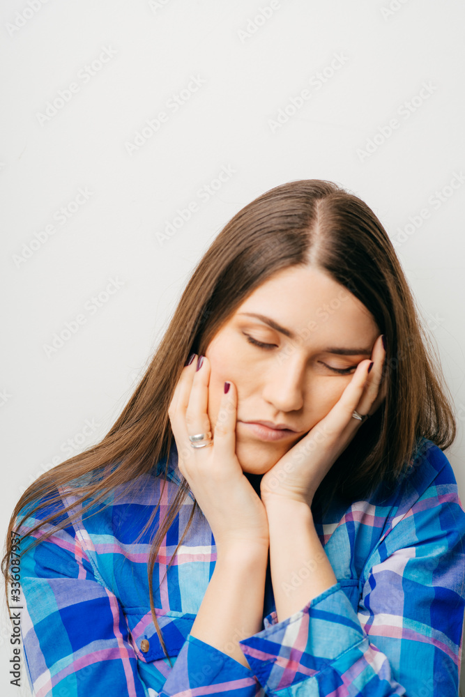 Sleepy or drowsy young woman