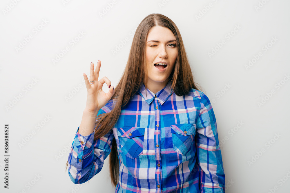 young woman with fringes showing ok young woman with fringes showing ok